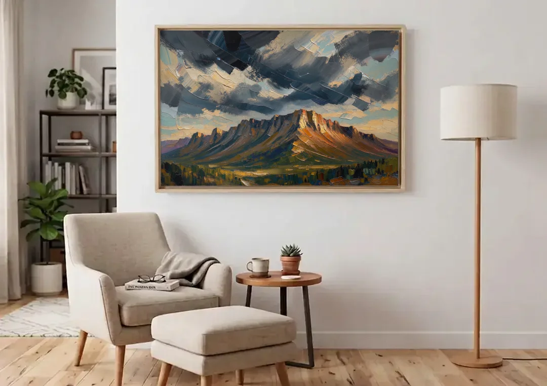 Moody Landscape Painting of the Storm Ridge canvas wall art above an armchair in a bright living room