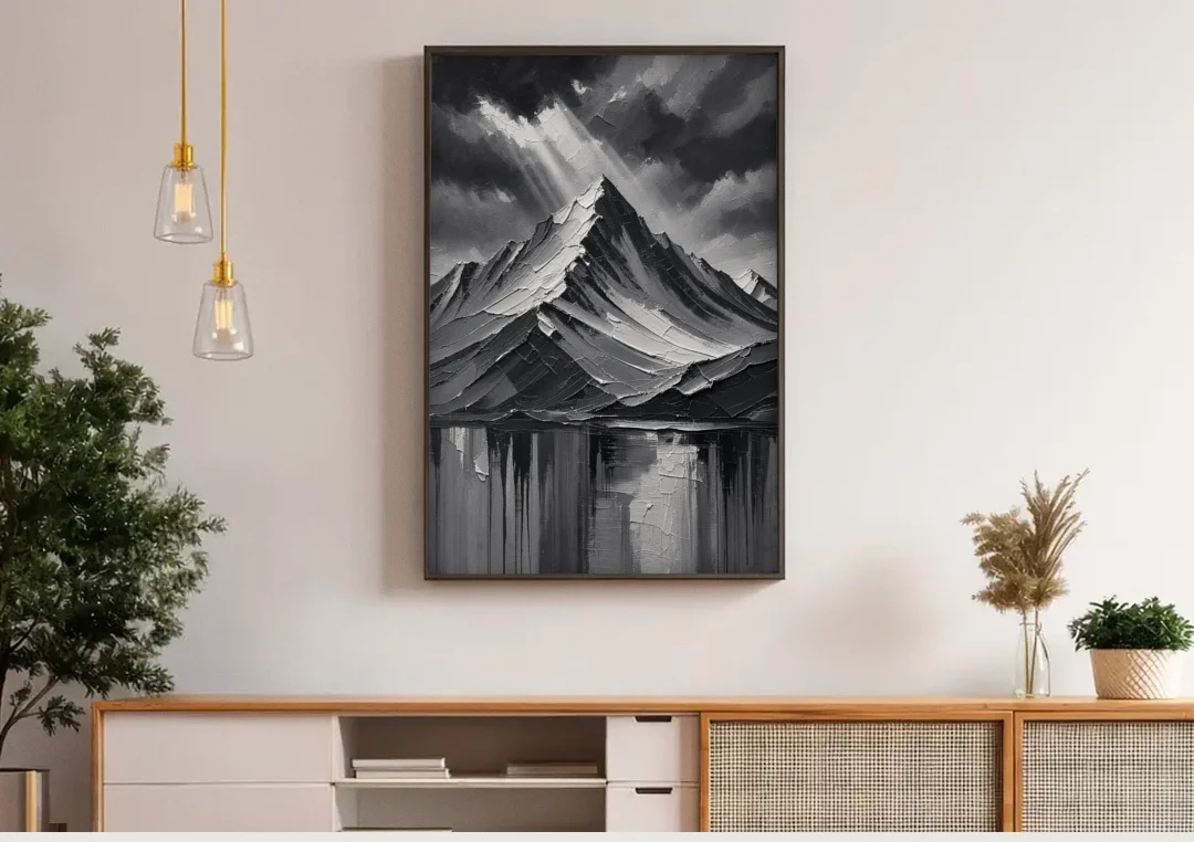 Moody Mountain Painting Under Breaking Light canvas wall art above a wooden sideboard under pendant lights
