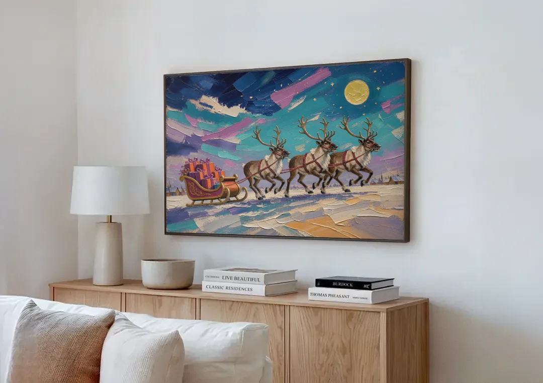 Large Christmas Moonlit Reindeer Sleigh Run canvas wall art above a wooden sideboard next to a sofa