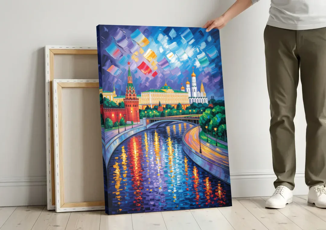 Moscow River Glimpse canvas wall art leaning against a wall next to blank canvases