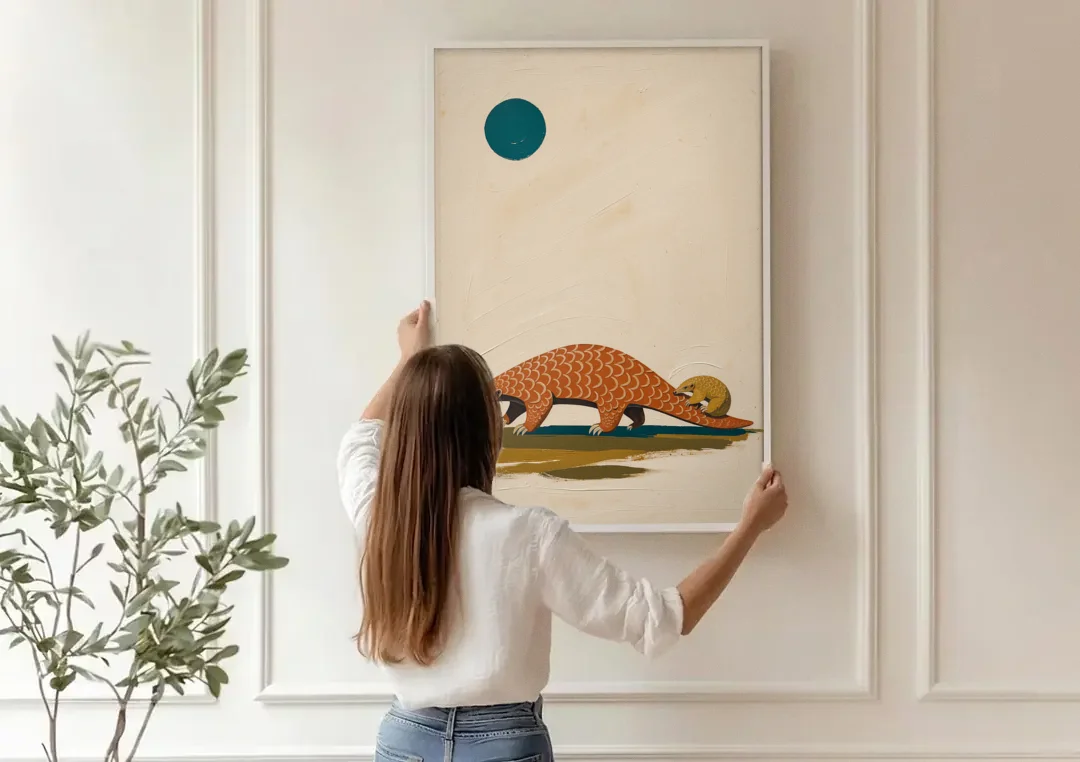 Mother Pangolin Carrying Her Baby on Her Tail canvas wall art being hung on a paneled wall