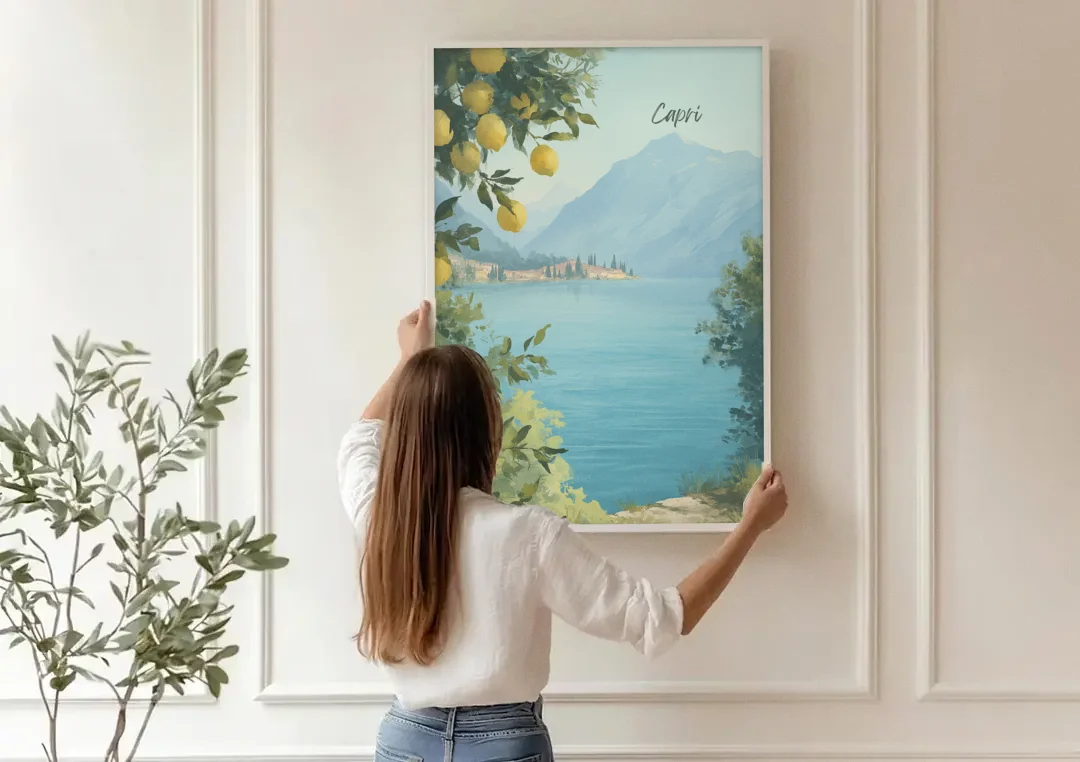 Mountain Lake Painting with Lemon Branches canvas wall art being hung on a paneled wall
