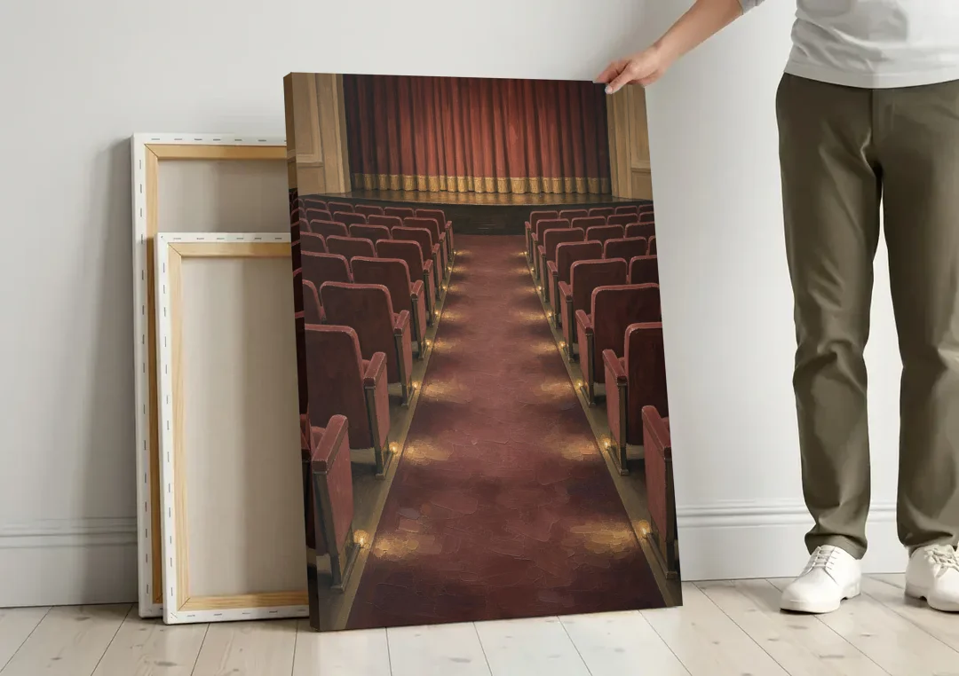 Movie Theater Painting of the Lit Aisle canvas wall art leaning against a wall next to blank canvases