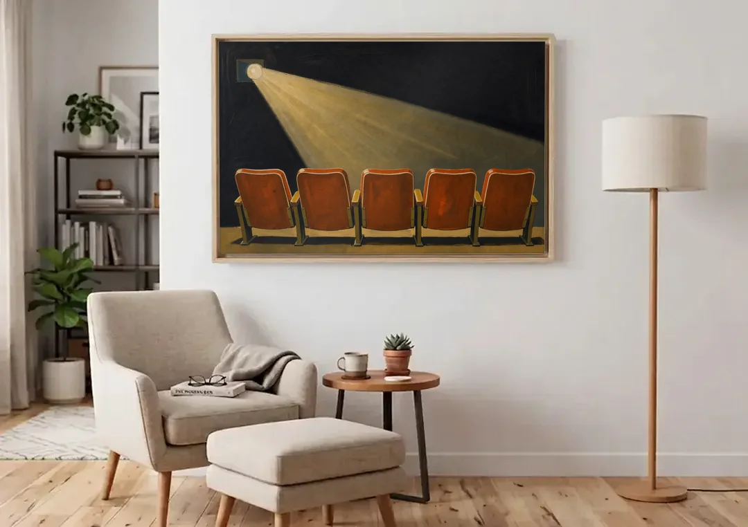Movie Theater Wall Art with Five Red Seats canvas wall art above an armchair in a bright living room