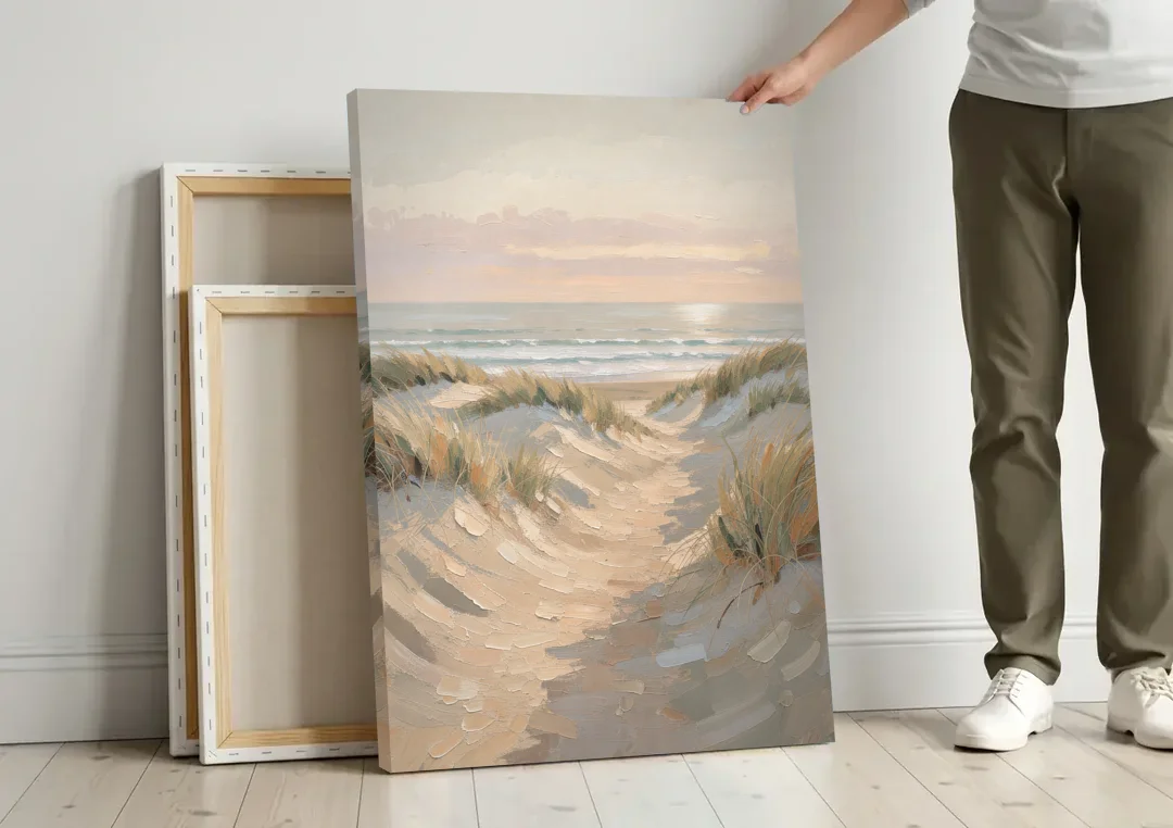 Muted Landscape Painting of a Dune Path canvas wall art leaning against a wall next to blank canvases