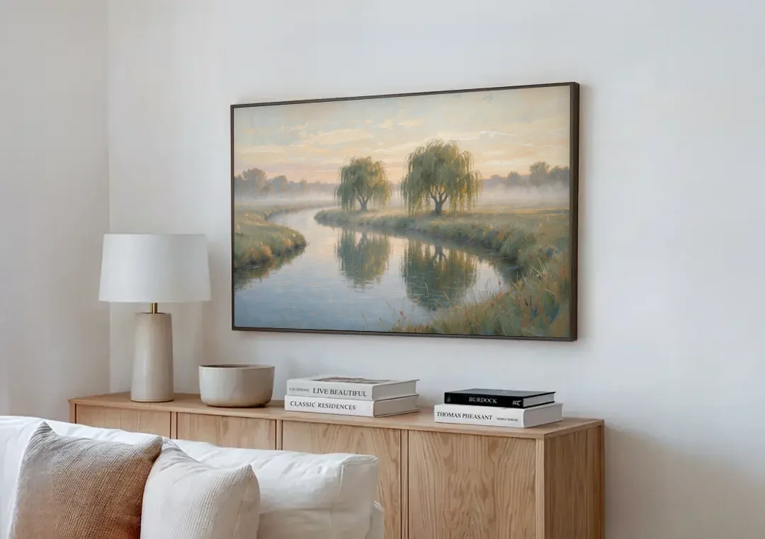 Muted Landscape Paintings of Willows at Dawn canvas wall art above a wooden sideboard next to a sofa