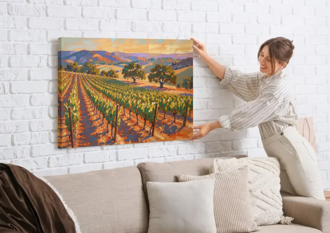 Napa Valley Wall Art of Golden Vines and Oaks canvas wall art being hung on a white brick wall above a sofa