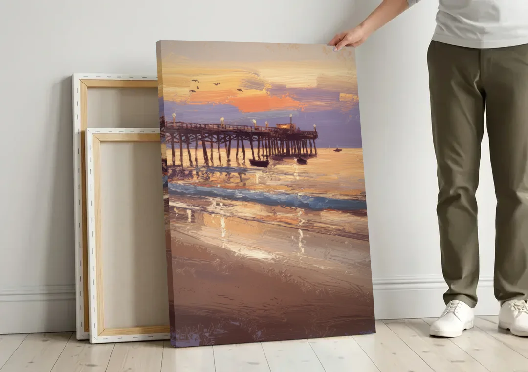 Naples Pier at Twilight canvas wall art leaning against a wall next to blank canvases