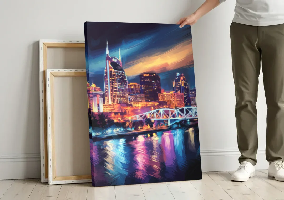 Nashville Bright Lights Skyline canvas wall art leaning against a wall next to blank canvases