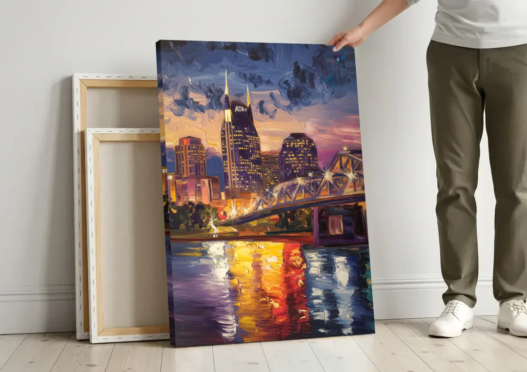Nashville Cumberland River Views canvas wall art leaning against a wall next to blank canvases