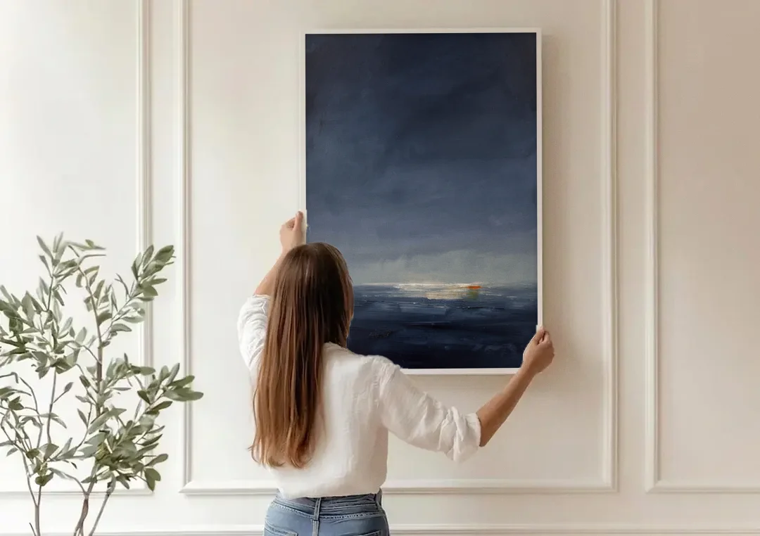 Navy Blue Abstract Wall Art with Last Light canvas wall art being hung on a paneled wall