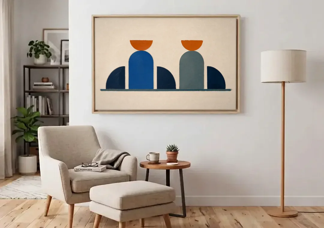 Navy Blue Wall Decor with Two Orange Suns canvas wall art above an armchair in a bright living room