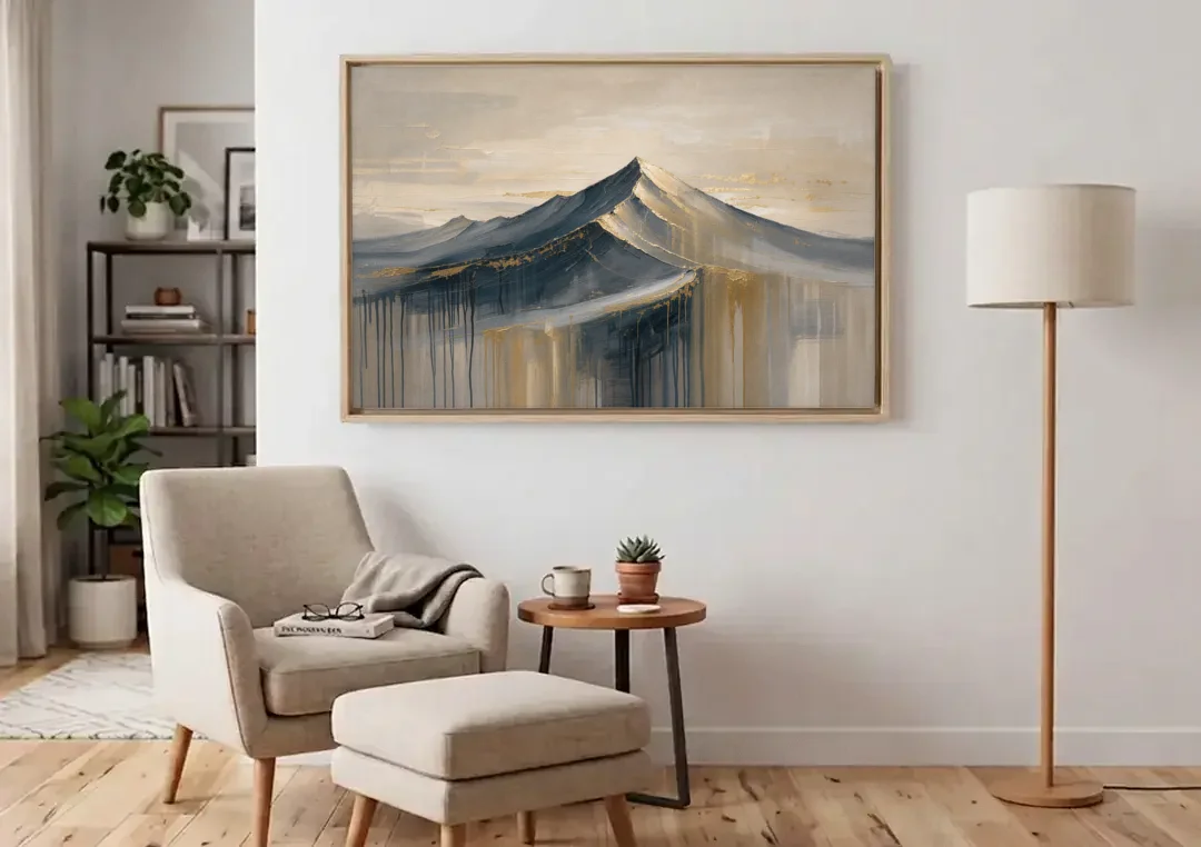 Navy Gold Abstract Painting of a Mountain Summit canvas wall art above an armchair in a bright living room