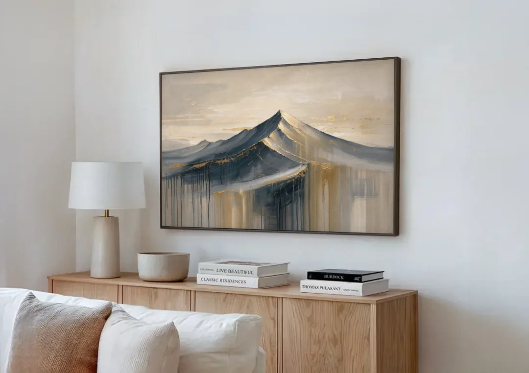 Navy Gold Abstract Painting of a Mountain Summit canvas wall art above a wooden sideboard next to a sofa