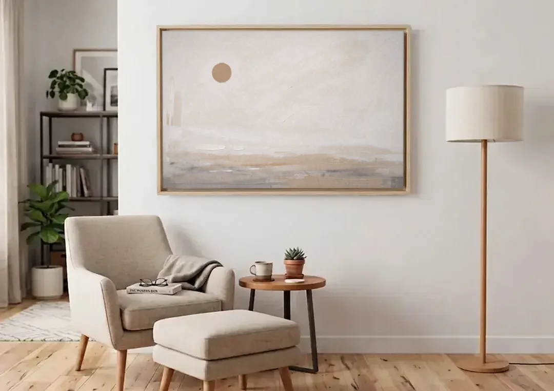 Negative Space Art with a High Clay Sun canvas wall art above an armchair in a bright living room