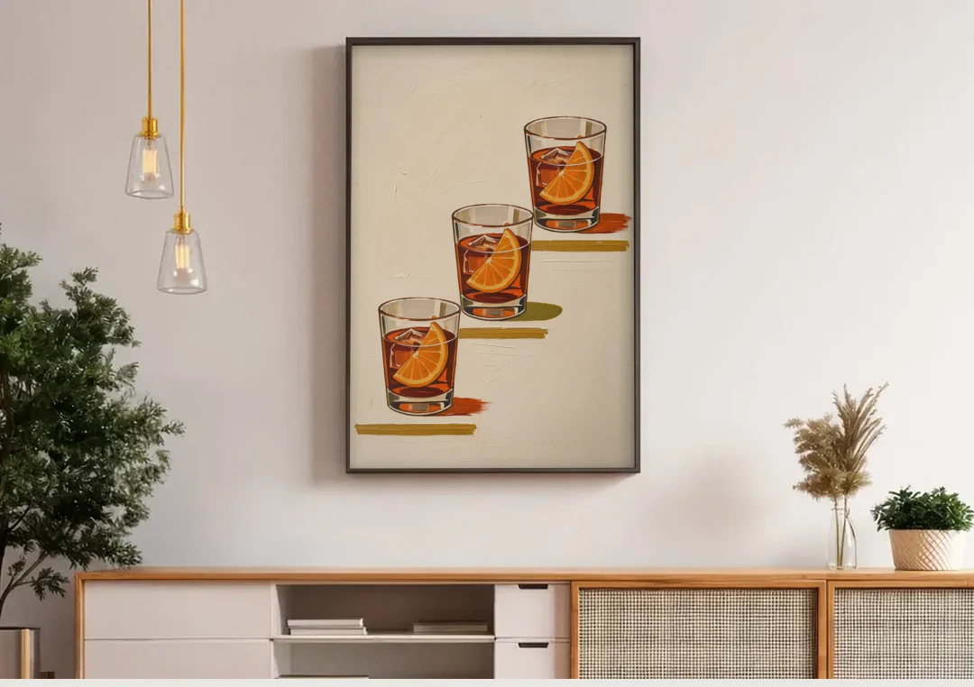 Negroni Wall Art with Three Orange Slices canvas wall art above a wooden sideboard under pendant lights
