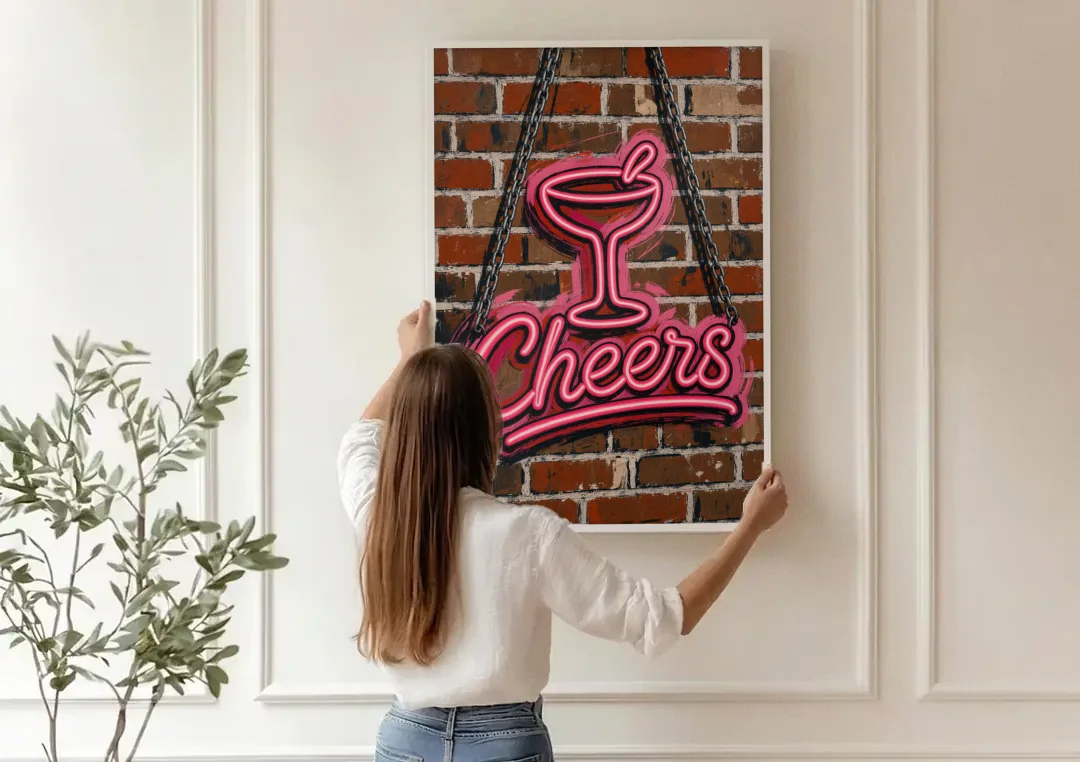 Neon Sign Wall Art Cheers Coupe on Brick canvas wall art being hung on a paneled wall