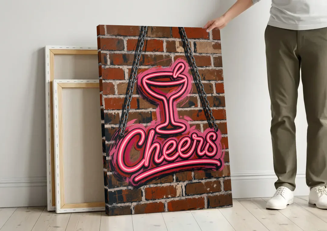 Neon Sign Wall Art Cheers Coupe on Brick canvas wall art leaning against a wall next to blank canvases