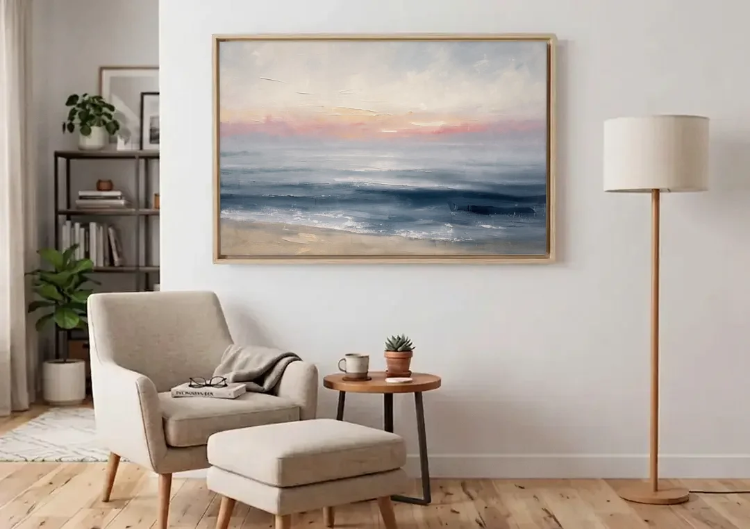 Neutral Abstract Painting of a Blush Horizon canvas wall art above an armchair in a bright living room