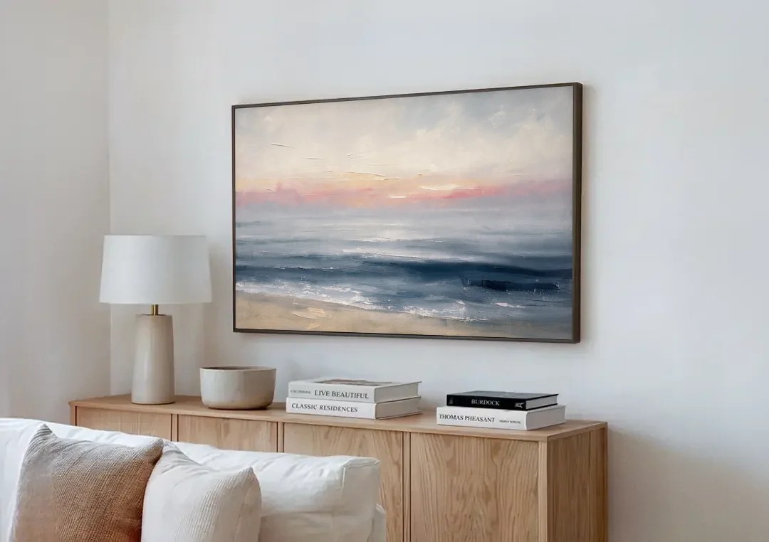 Neutral Abstract Painting of a Blush Horizon canvas wall art above a wooden sideboard next to a sofa