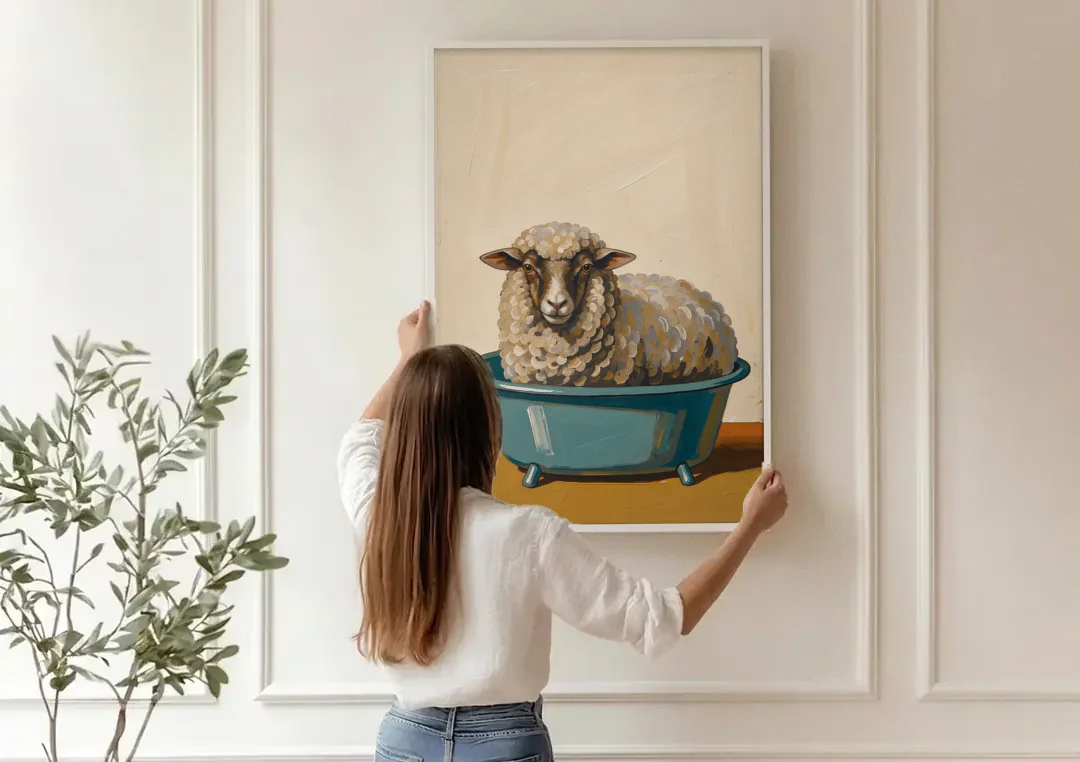 Neutral Bathroom Wall Decor Sheep in a Washtub canvas wall art being hung on a paneled wall