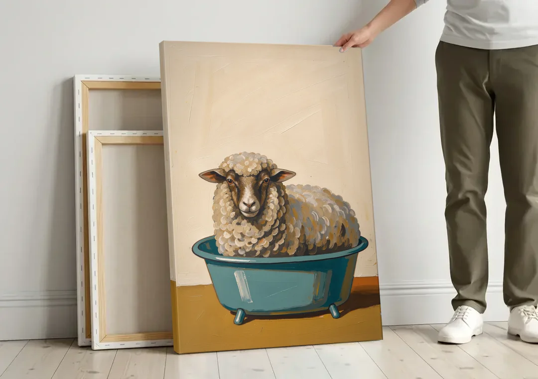 Neutral Bathroom Wall Decor Sheep in a Washtub canvas wall art leaning against a wall next to blank canvases