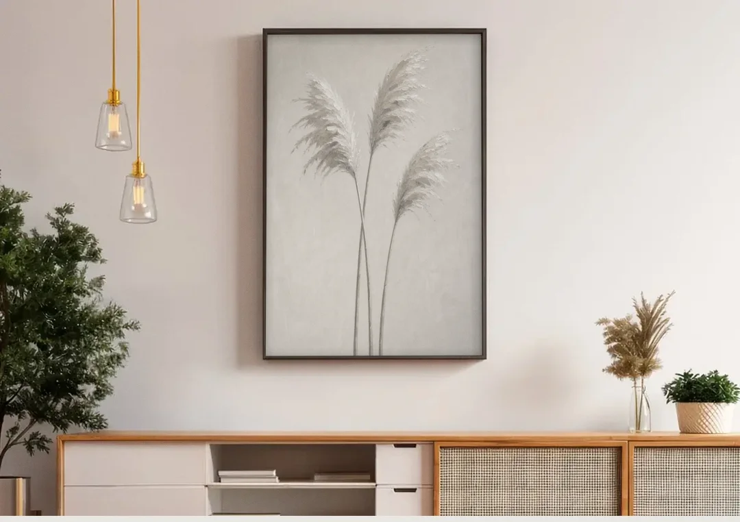 Neutral Botanical Prints of Pampas Grass Plumes canvas wall art above a wooden sideboard under pendant lights