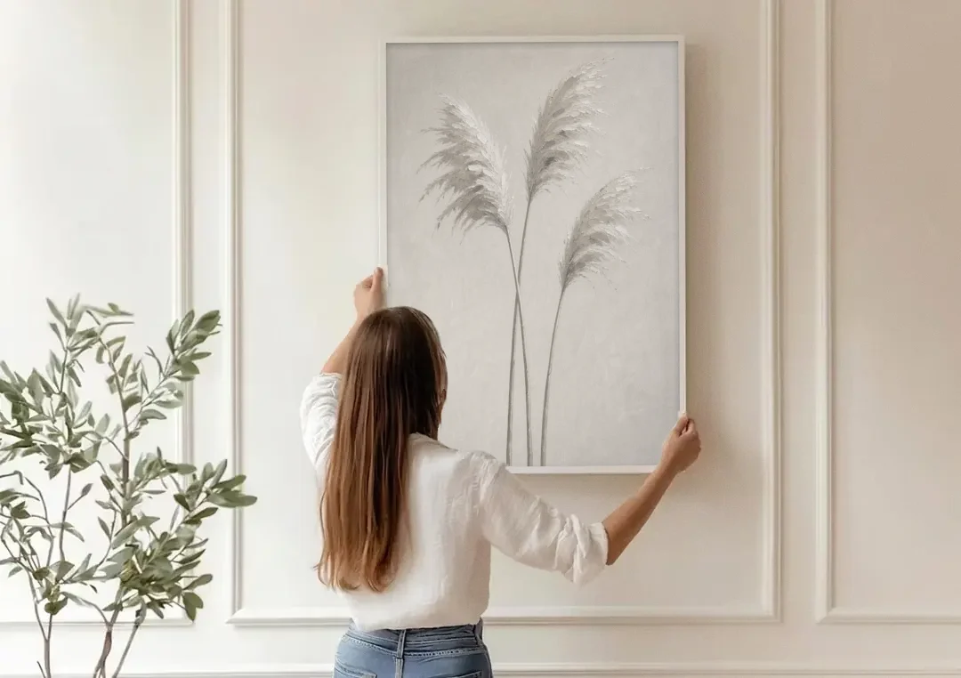 Neutral Botanical Prints of Pampas Grass Plumes canvas wall art being hung on a paneled wall