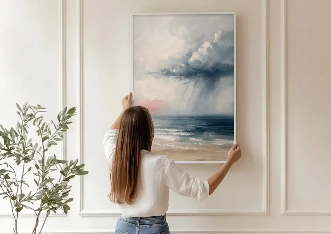 Neutral Distant Rain Squall Over a Calm Sea canvas wall art being hung on a paneled wall