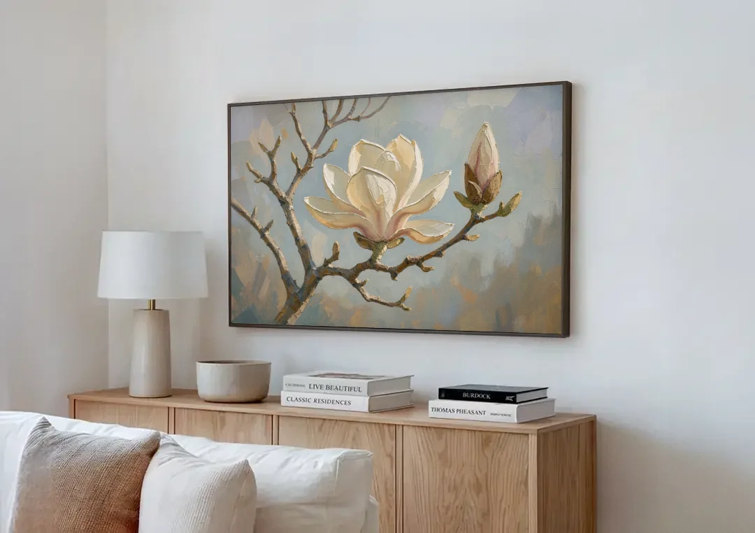 Neutral Flower Painting of a Cream Magnolia Branch canvas wall art above a wooden sideboard next to a sofa