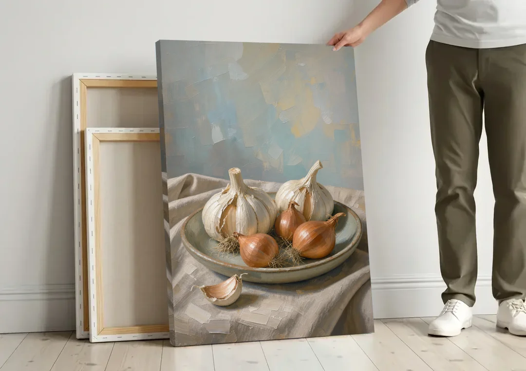 Neutral Garlic and Shallots on Linen for the Kitchen canvas wall art leaning against a wall next to blank canvases