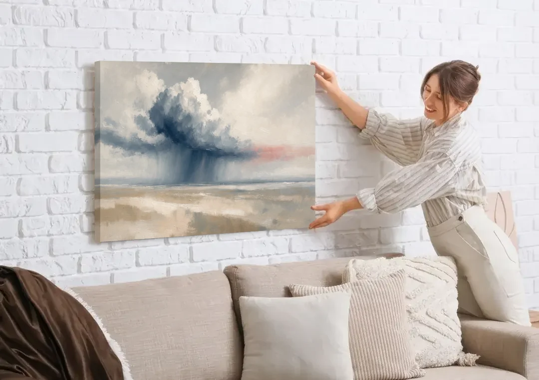 Neutral Landscape of Passing Rain Over the Plain canvas wall art being hung on a white brick wall above a sofa