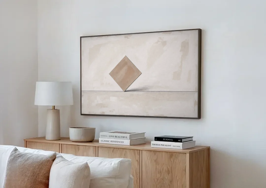 Neutral Modern Wall Art of a Balancing Square canvas wall art above a wooden sideboard next to a sofa