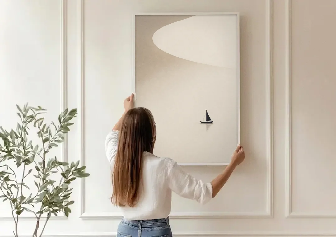 Neutral Wall Art of a Becalmed Sailboat canvas wall art being hung on a paneled wall