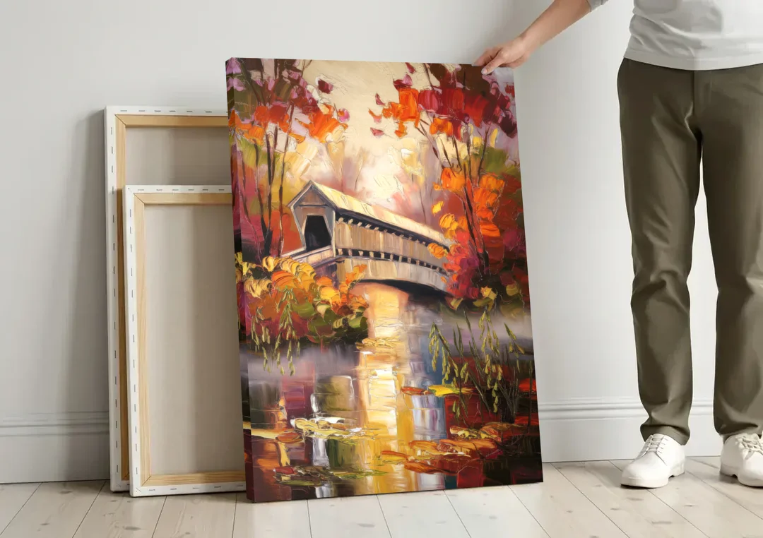 New Hope Covered Bridge Scene canvas wall art leaning against a wall next to blank canvases