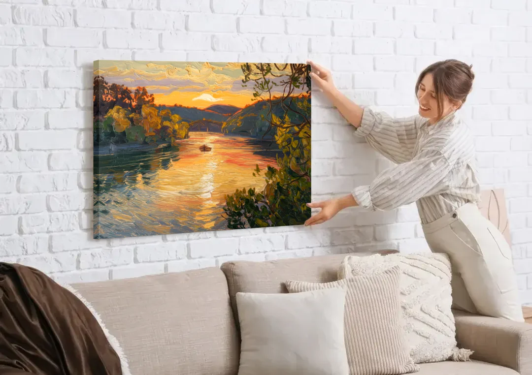 New Hope Delaware River Sunset canvas wall art being hung on a white brick wall above a sofa