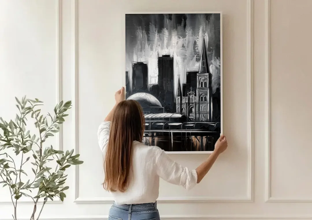 New Orleans Black and White Skyline canvas wall art being hung on a paneled wall