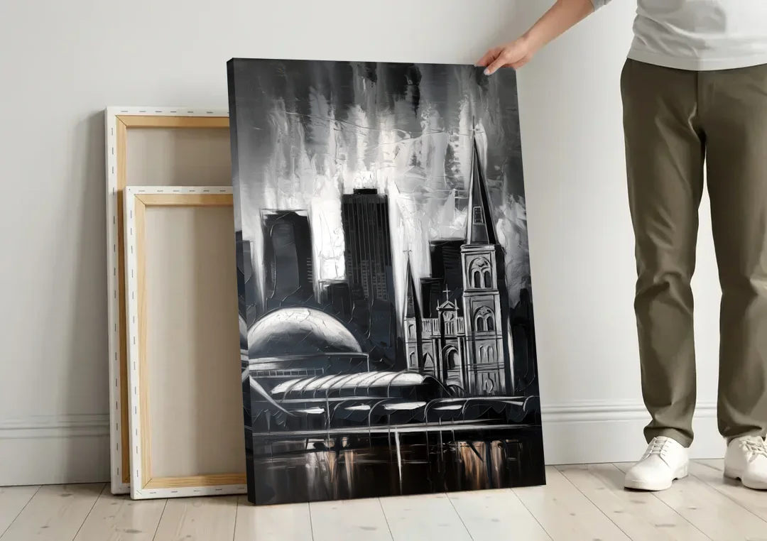 New Orleans Black and White Skyline canvas wall art leaning against a wall next to blank canvases