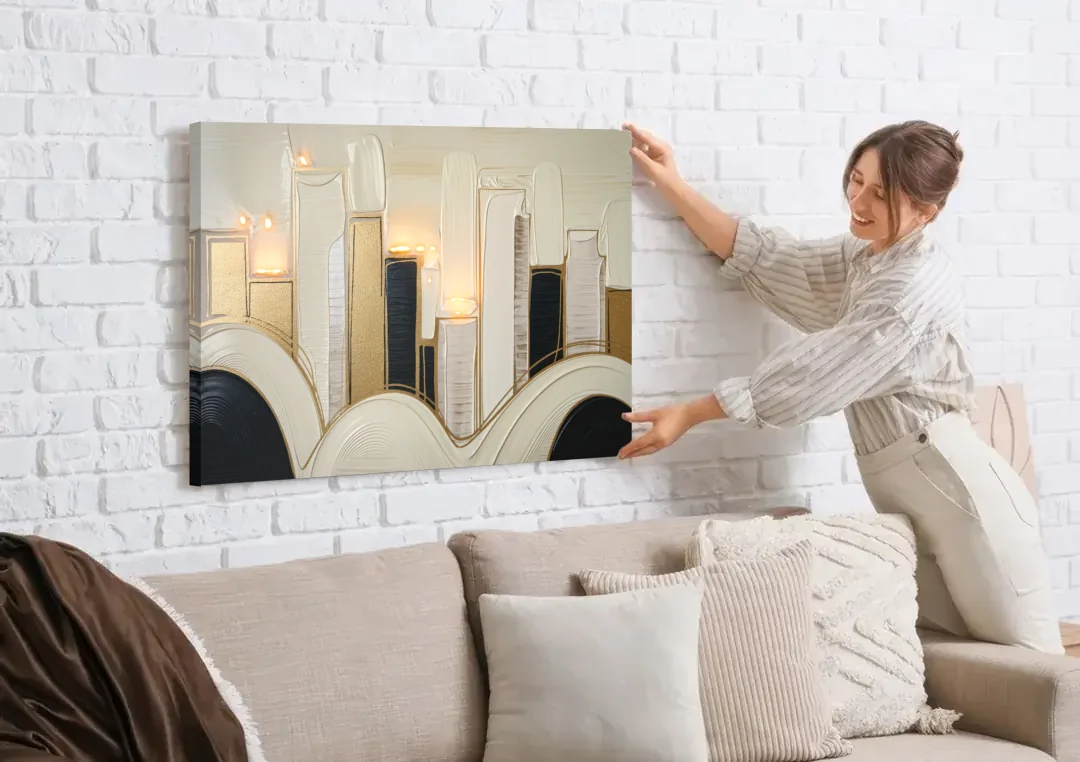 New York City Golden Glow Skyline canvas wall art being hung on a white brick wall above a sofa