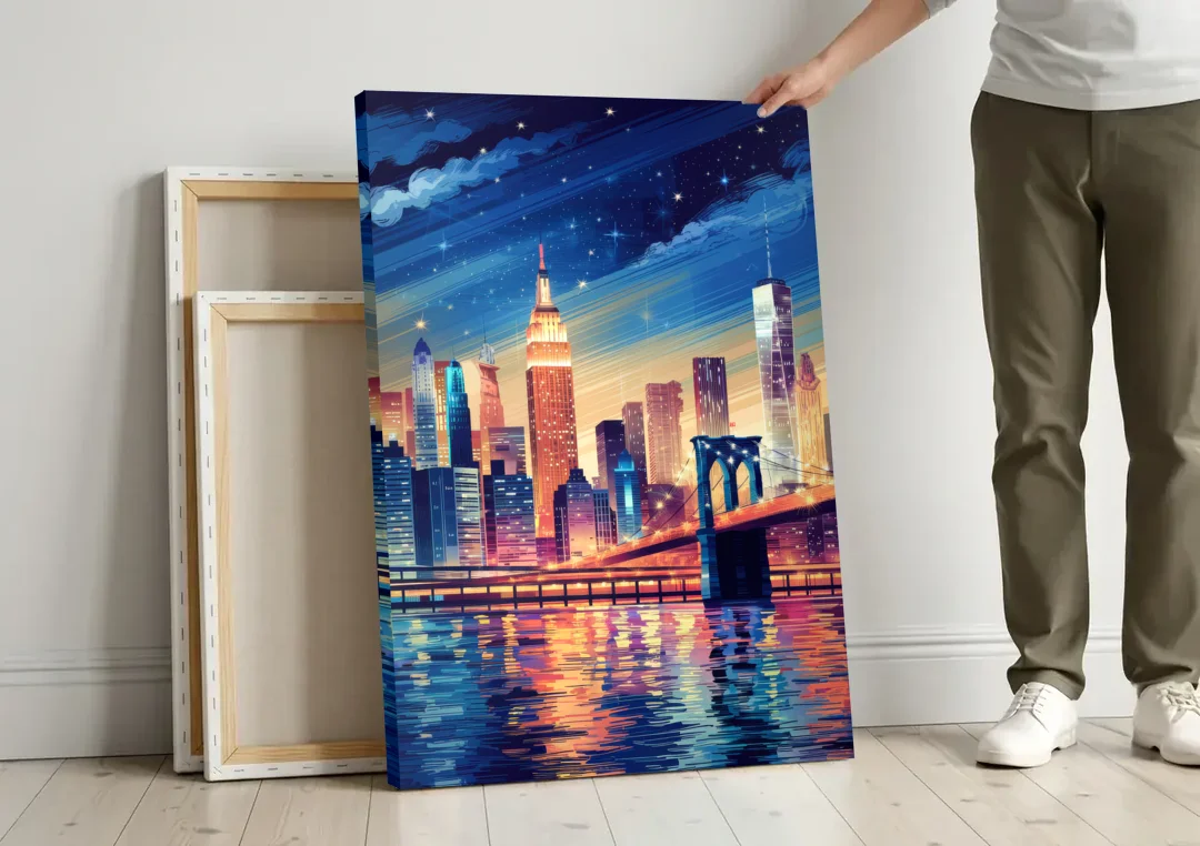 New York City Night Lights canvas wall art leaning against a wall next to blank canvases