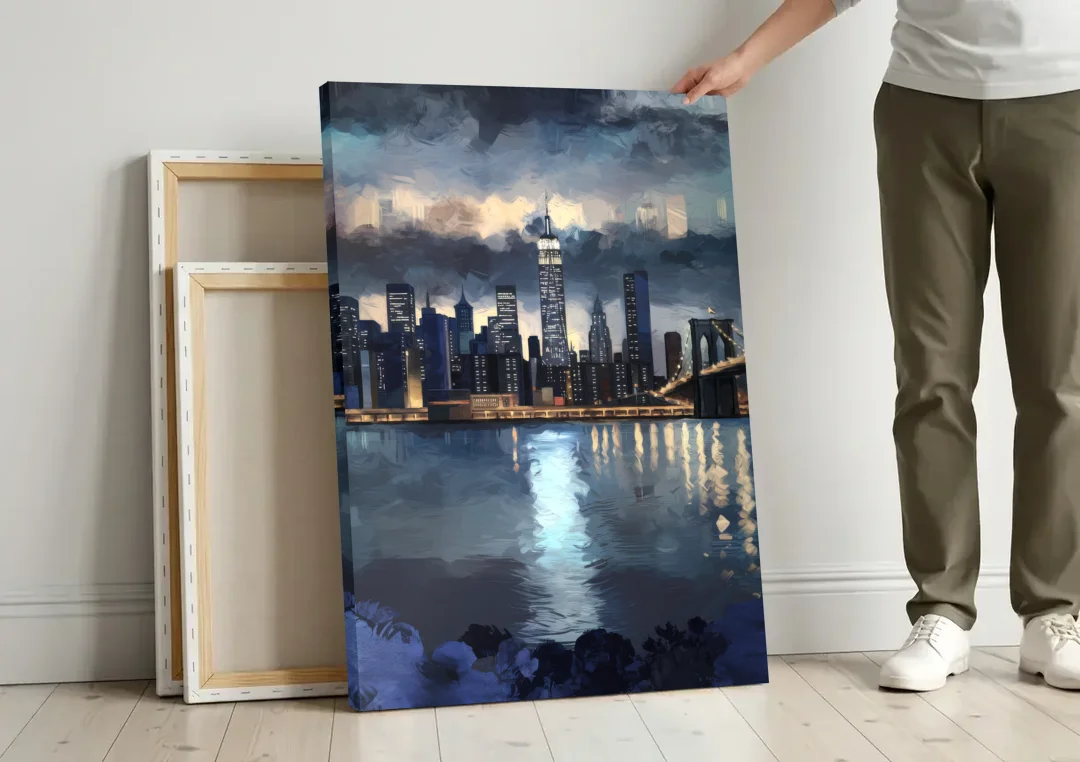 New York City Skyline in Blue Tones Hudson canvas wall art leaning against a wall next to blank canvases