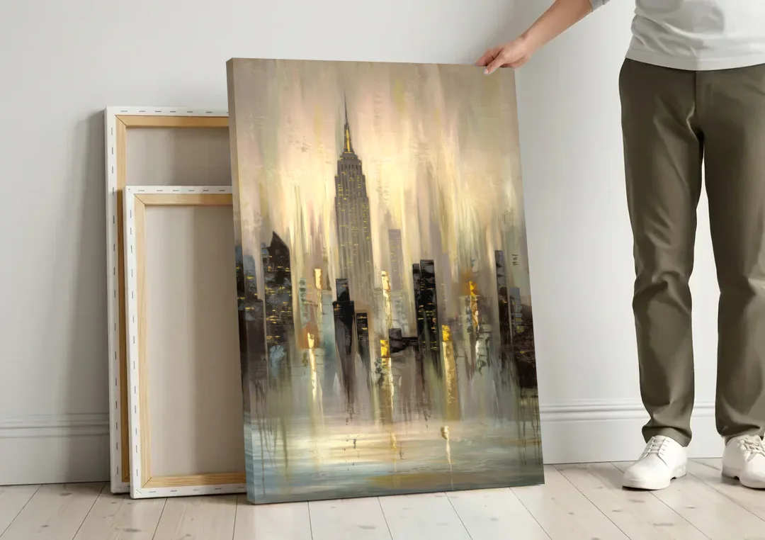 New York City Skyline in Fog canvas wall art leaning against a wall next to blank canvases