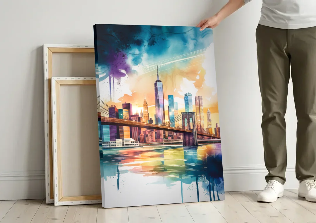 New York City Skyline in Watercolor Hudson canvas wall art leaning against a wall next to blank canvases