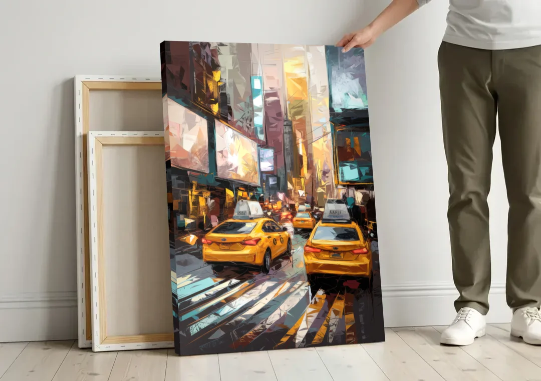 New York City Taxi Cabs canvas wall art leaning against a wall next to blank canvases
