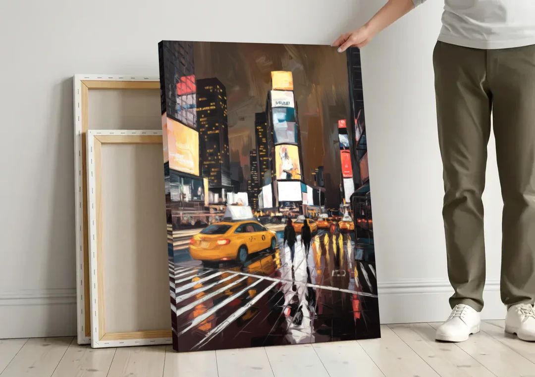 New York City Times Square in Motion Night canvas wall art leaning against a wall next to blank canvases