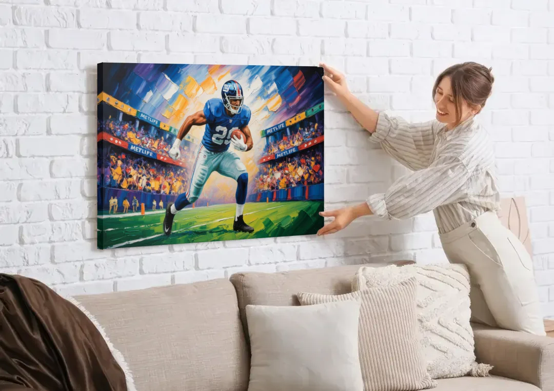 New York Giants Dynamic Impressionistic Action Art canvas wall art being hung on a white brick wall above a sofa