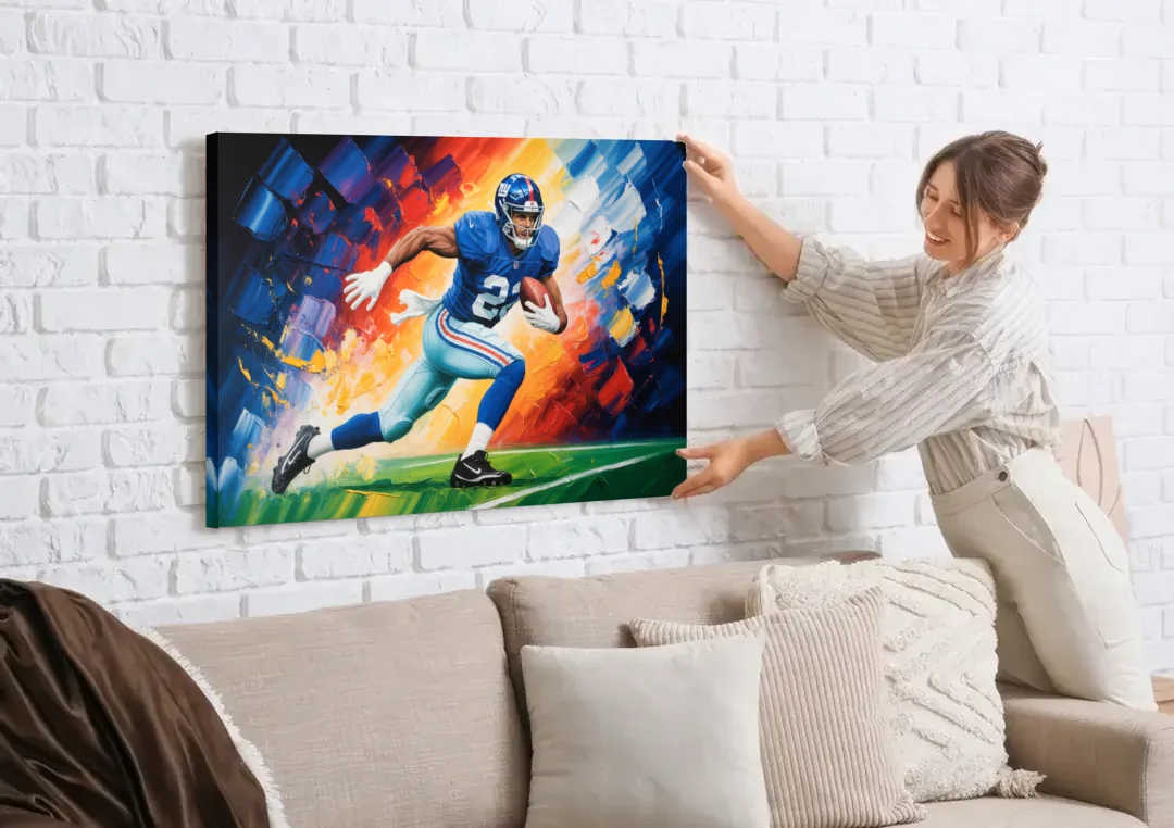 New York Giants Impressionistic Football Action Art canvas wall art being hung on a white brick wall above a sofa