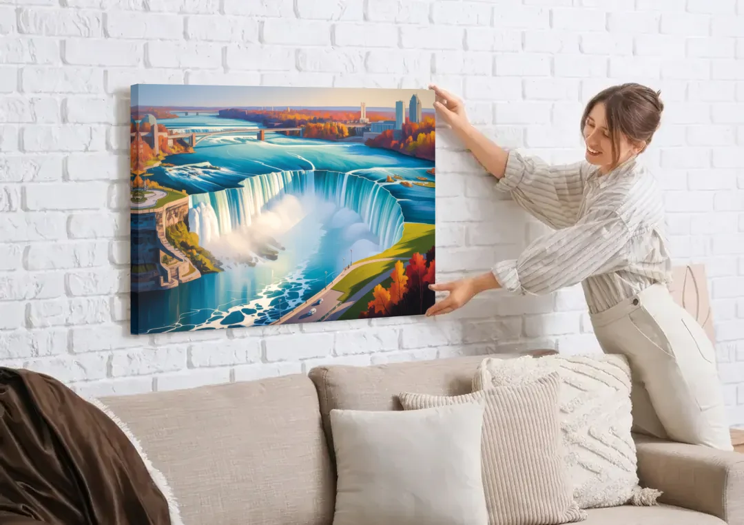 Niagara Falls from Above canvas wall art being hung on a white brick wall above a sofa