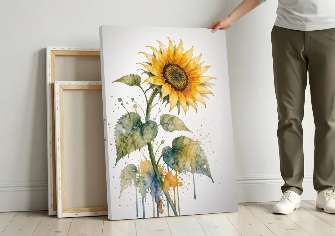 Farmhouse Nodding Watercolor Sunflower with Dripping Leaves canvas wall art leaning against a wall next to blank canvases