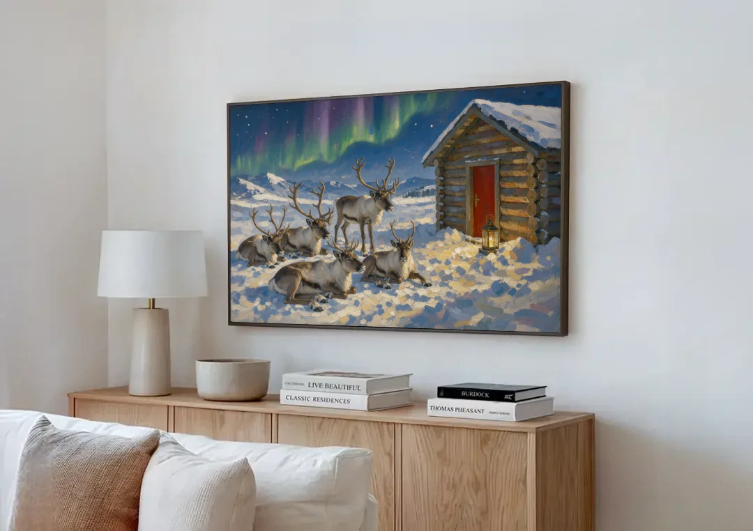 North Pole Wall Art of Resting Reindeer canvas wall art above a wooden sideboard next to a sofa
